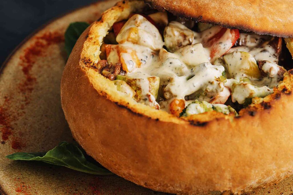 Pork Medallions with Mushroom Sauce Served in Bread Pot