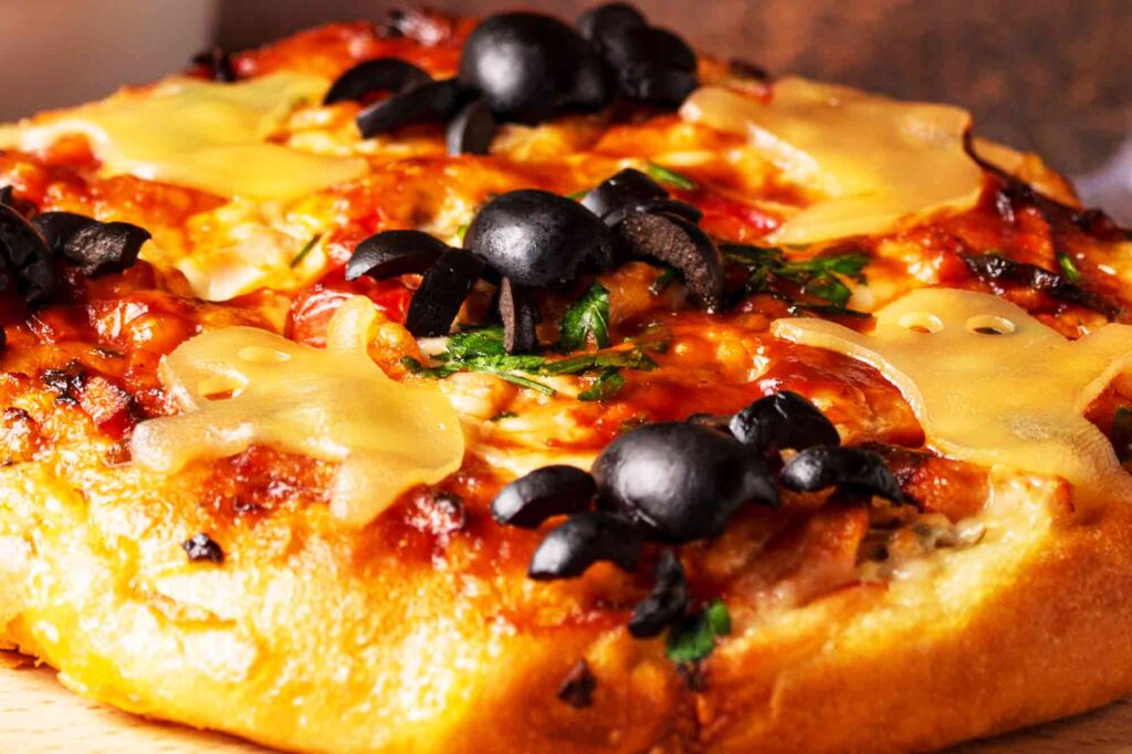 Halloween Pizza With Cheese Ghosts And Olive Spider Recipe