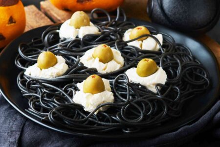 Halloween Black Spaghetti with Cheese and Olive Eyes